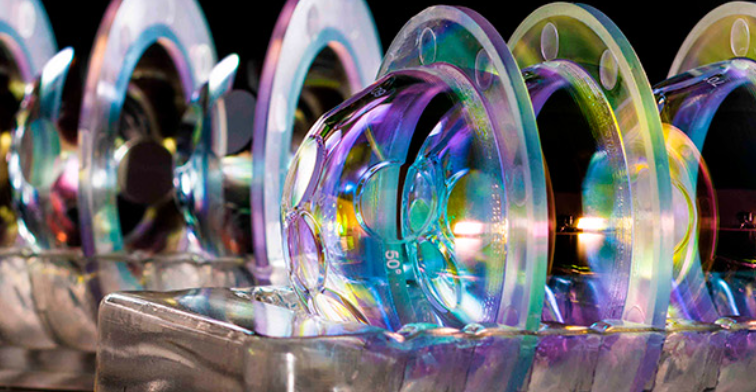 Laser optics with the coatings reflecting different coloured light.